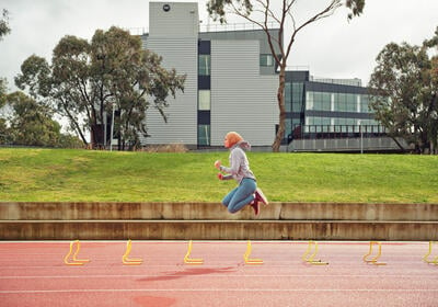 Athlete running on Waurn Ponds athletics track