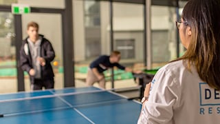 Students play table tennis at the Deakin student accommodation