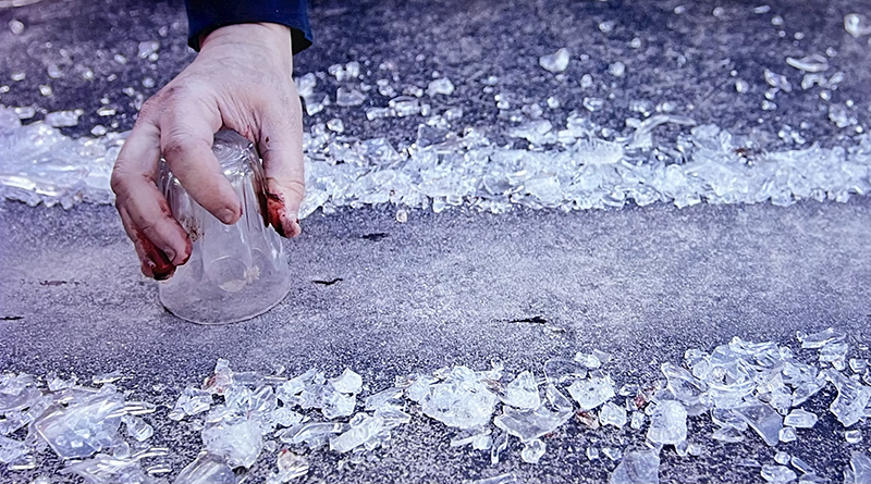 A hand near water. detail of a photo by Aaron Hoffman