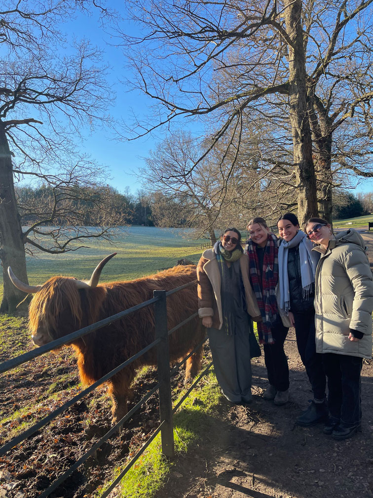 Hannah and friends with a Highland Cow