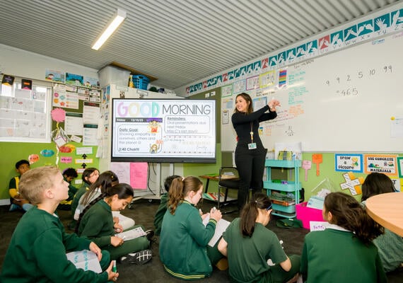 Deakin student Cassandra Cardullo on teaching placement in classroom full of primary school students