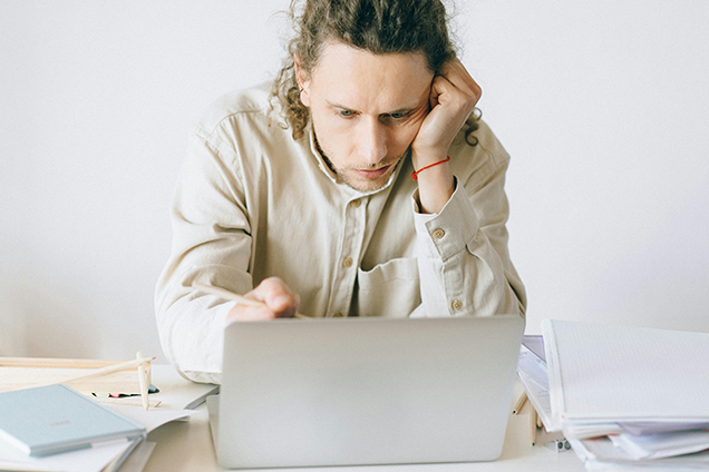 Person sitting in front of computer.